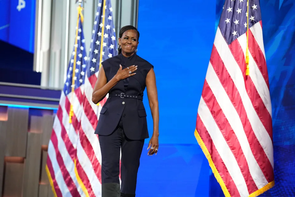 Former first lady Michelle Obama walks onstage on night two of the Democratic National Convention.